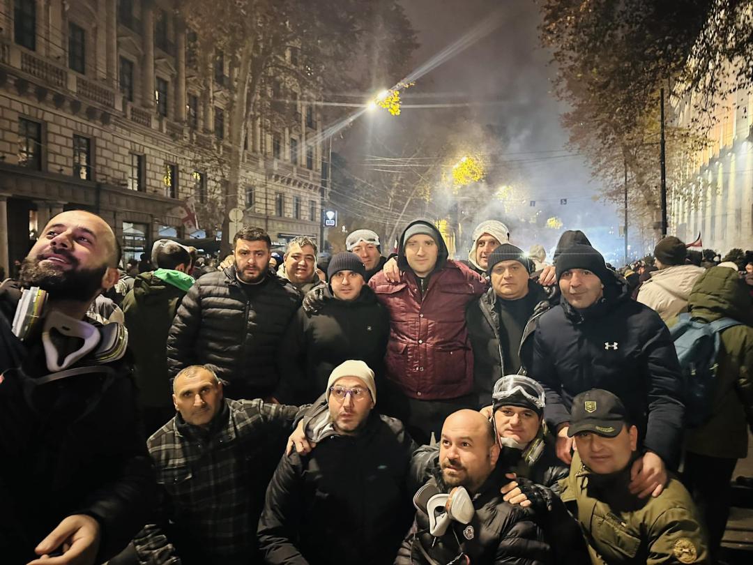 Irakli Pavlenishvili (red jacket) with protesters